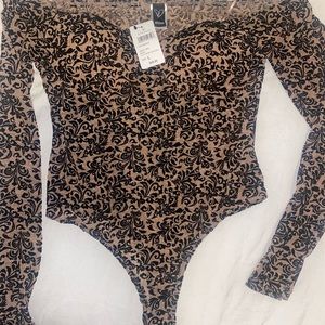 Body suit great for brunch or a night out even a special date! Brand new !!!